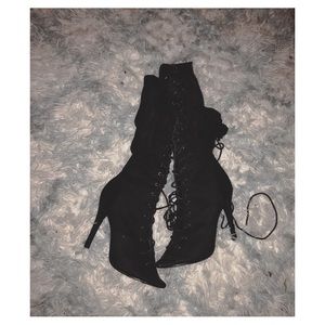 Laced up thigh high heels